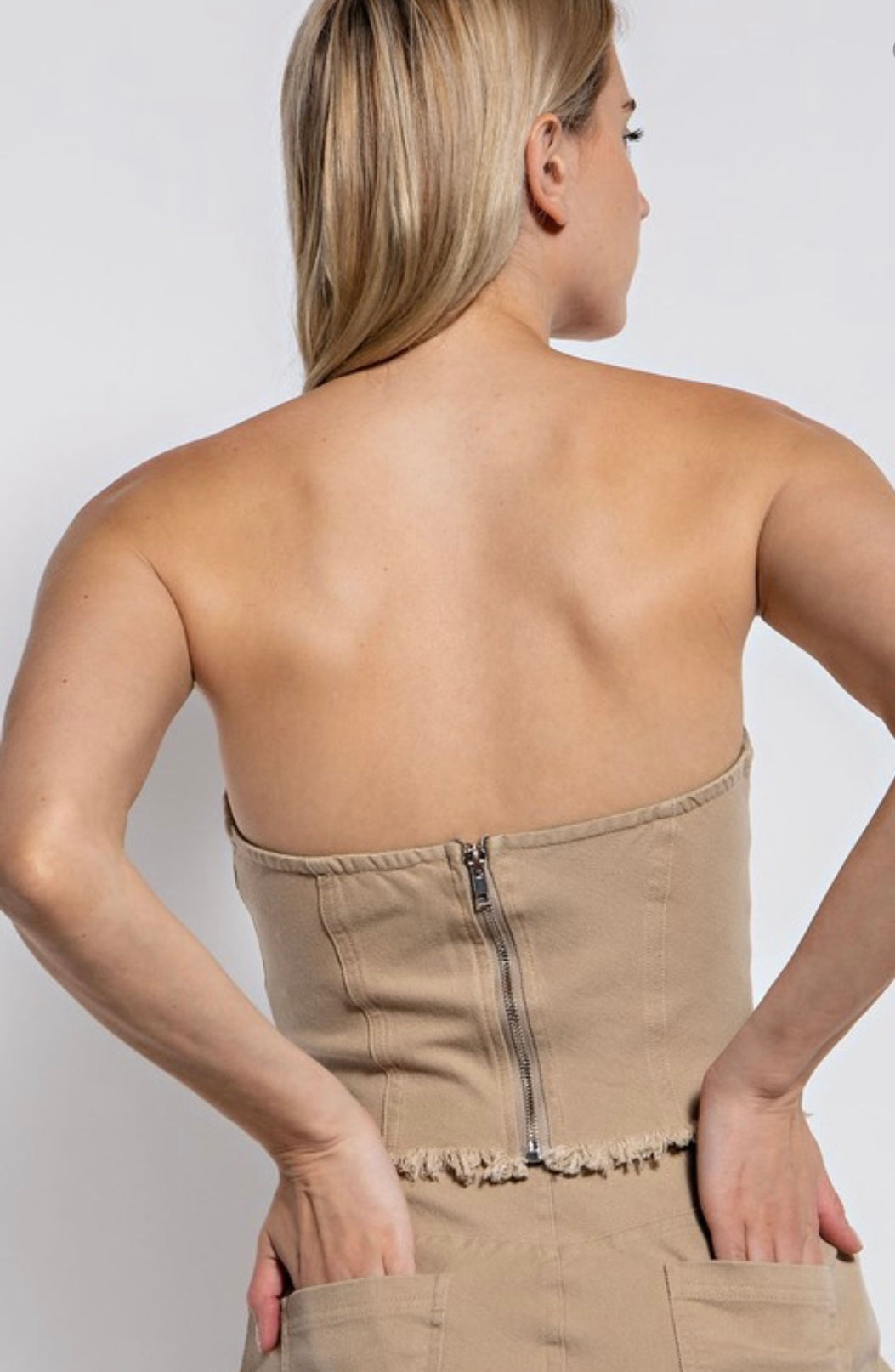 Distressed denim strapless top